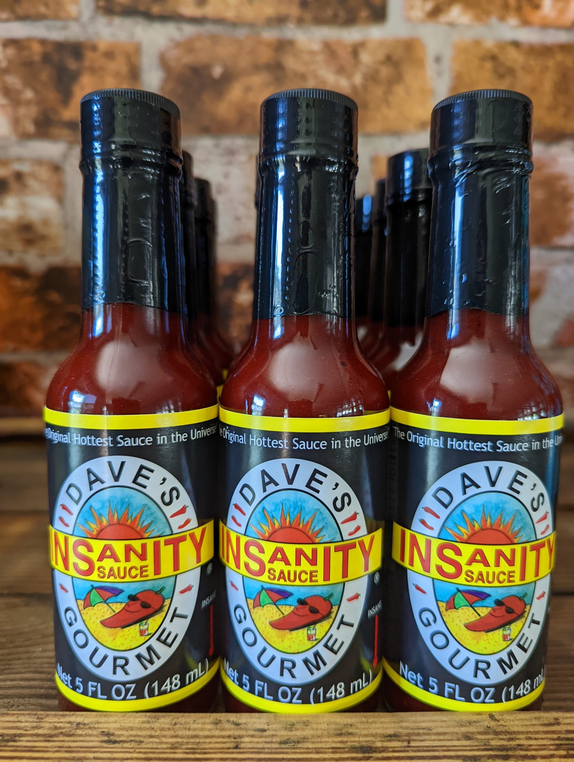 Picture of bottles of the famous Dave's Insanity Sauce on the shelf at the Chilli Ranch.