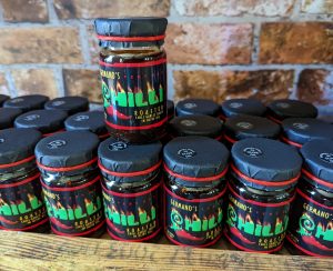 Picture of Germano's chili and garlic sauces on the shelf here at the Chilli Ranch.